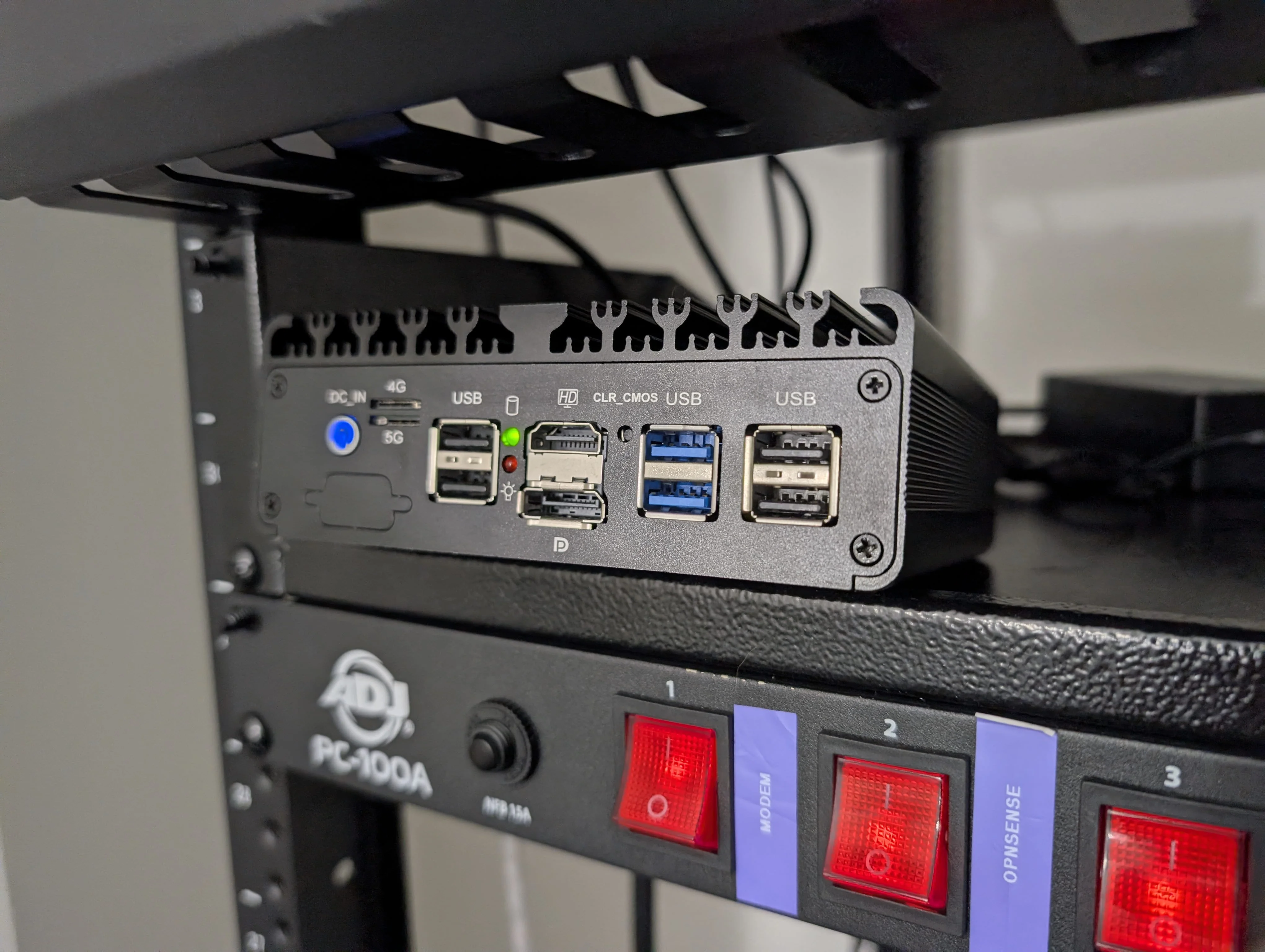 My OPNsense mini pc sitting on my server rack.